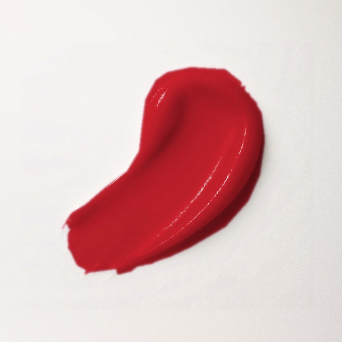 Glossy, comfortable texture of a tinted lip treatment that evens out dark or black lips and visibly softens lip hyperpigmentation, N°4 La Bouche Parfaite